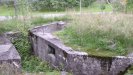 Concrete trench with a storage cubbyhole.