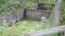 The permanent centre partition is not original, as it has been erected later on to prevent anyone from easily opening the dam, the end one is original.