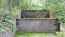 Shot from another angle, showing how the end is made of multiple concrete blocks piled up on top of each other.