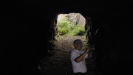 In the middle of the tunnel, with the entrance door to the complex on the right. This kind of construction prevents pressure mounting against the door if bombs drop near the tunnel entrances, and also provides a second exit if one caves in.