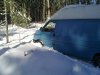 Trying to get the van out of the way, and into a snowy parking space.