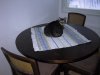 Fat cat infestation on the dining table.