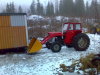 Massey-Ferguson 165 with cabin add-on and front loader.