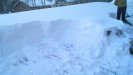 Removing snow from a roof during winter 2010.