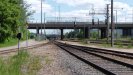 A large rail yard just the station, with the lonely track coming in from extreme left.